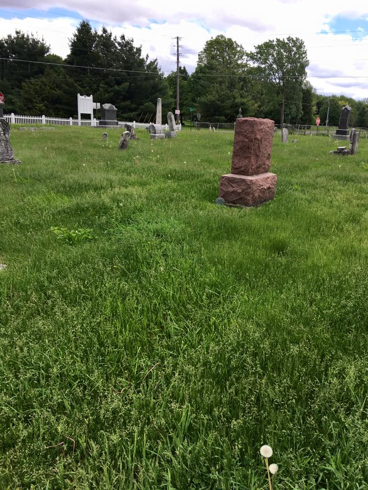 Open cemetery section with pathways and memorial markers.